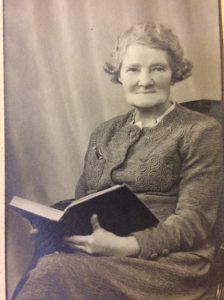 Eliza Phippard posing with a book